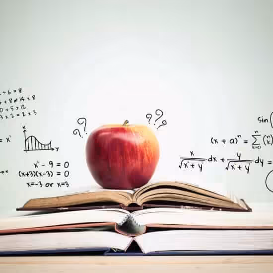 apple stack open books with education doodles copy space education concept