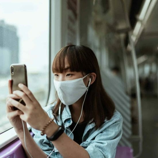 woman wearing a face mask on the subway