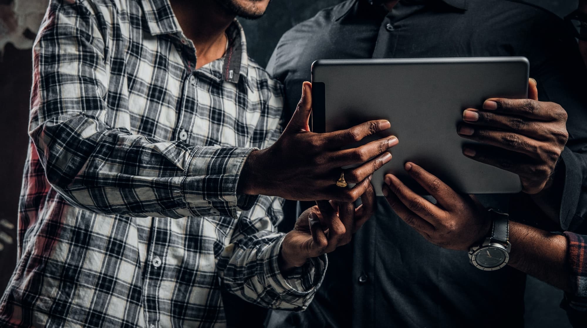 Tablet computer which is kept by three Indian students