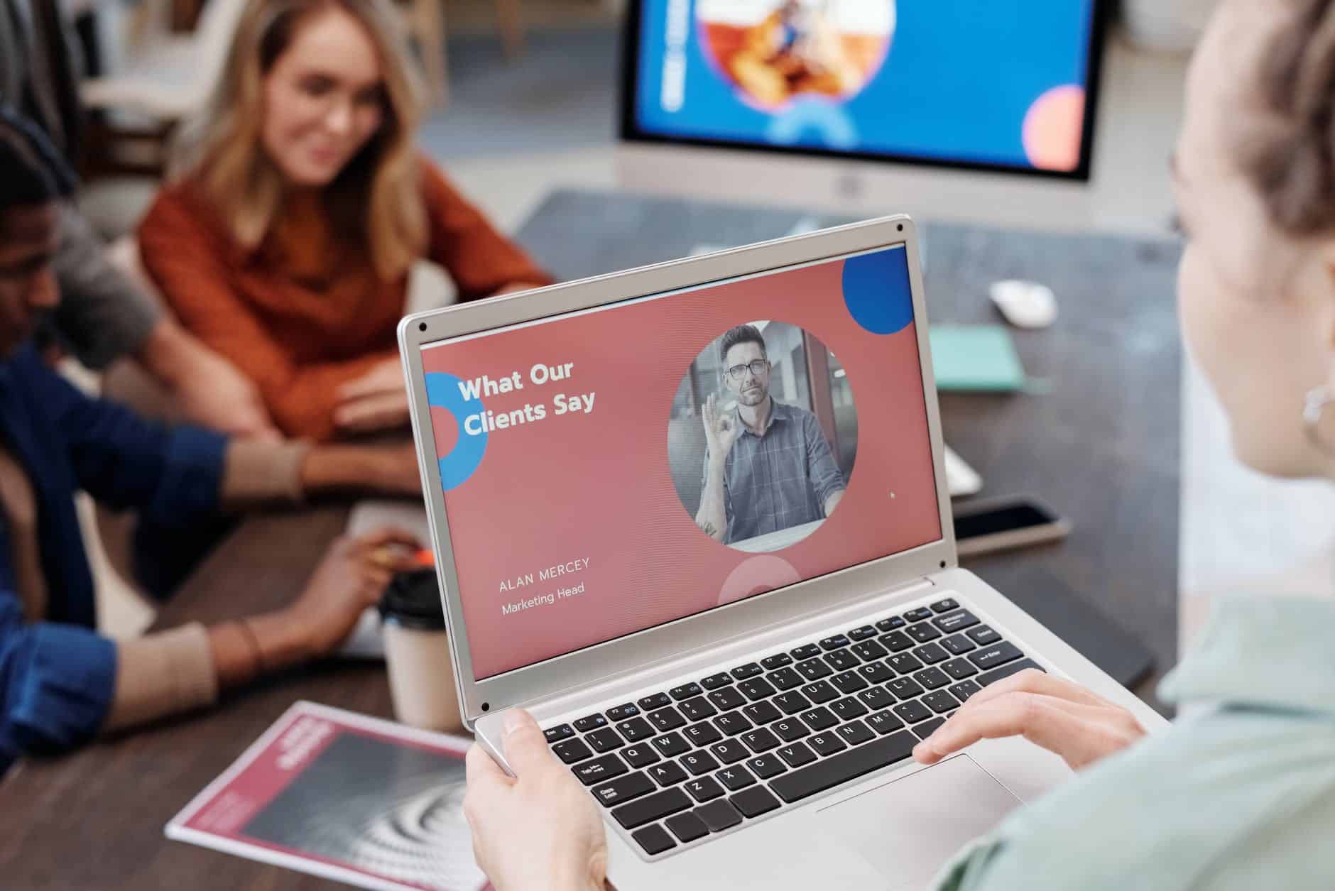 woman in orange shirt using macbook air, wordpress testimonial sliders