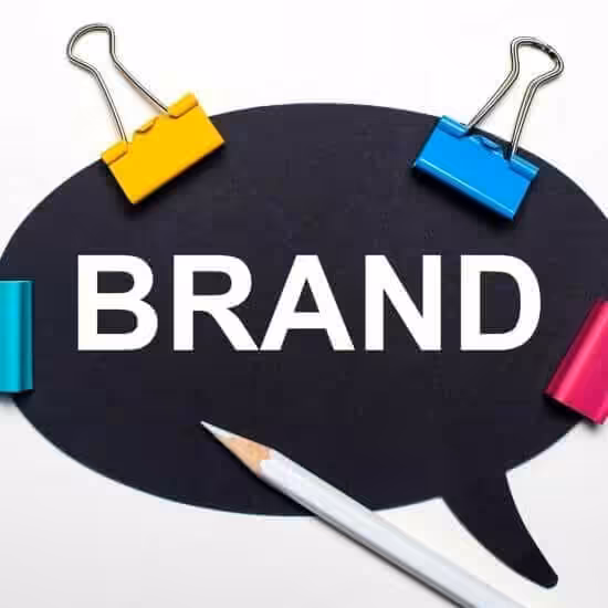 light surface multi colored paper clips white pencil black paper with words brand 1