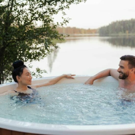 couple looking at each other while relaxing in a jacuzzi