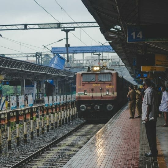 People watching as a train approaches in India