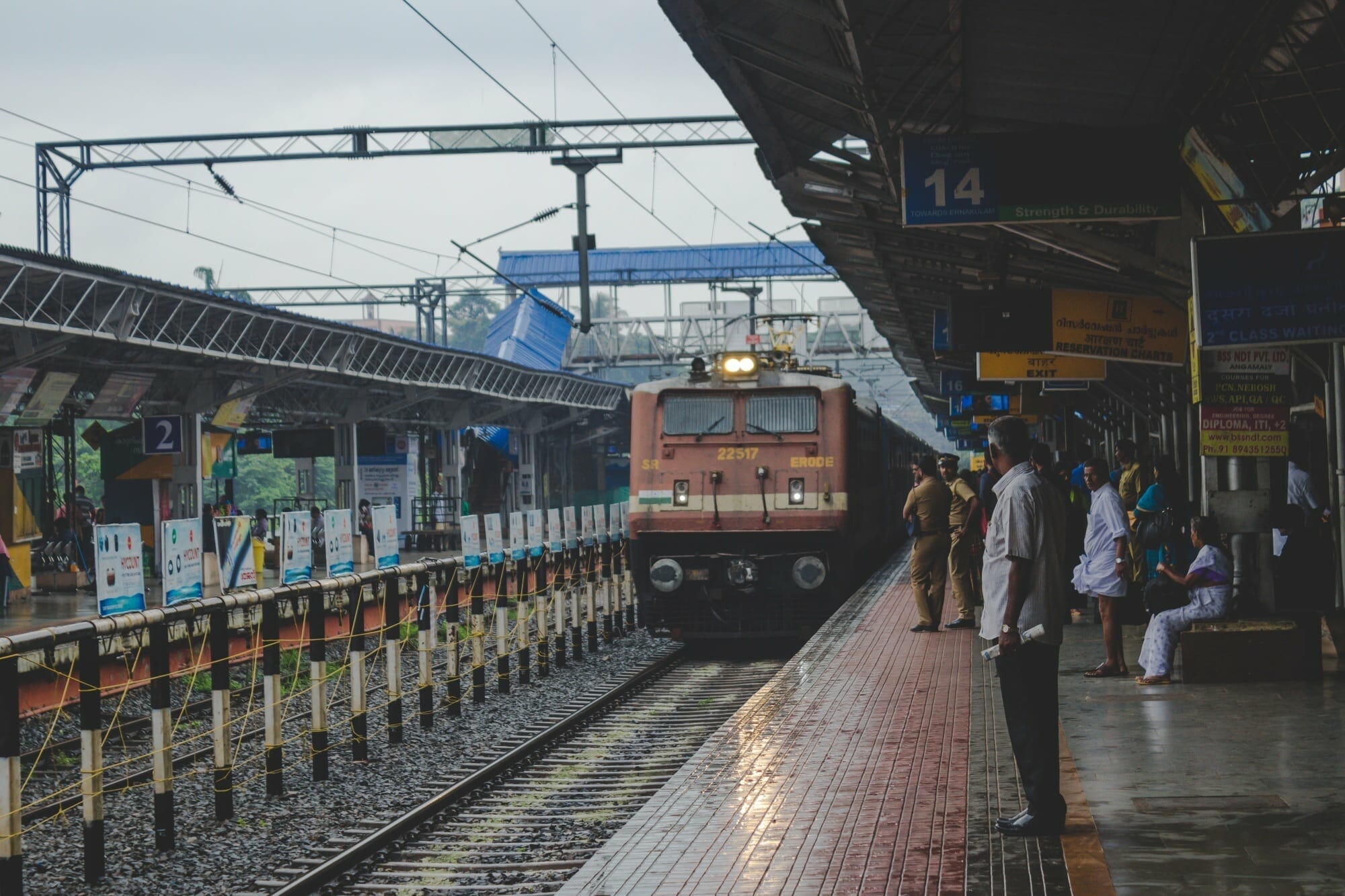 People watching as a train approaches in India