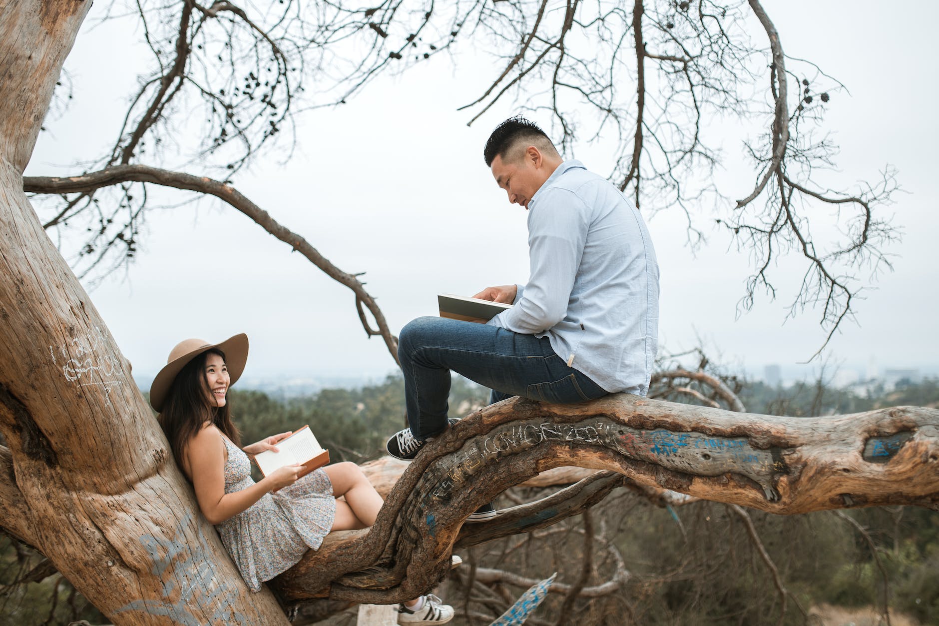 couple reading books outside
