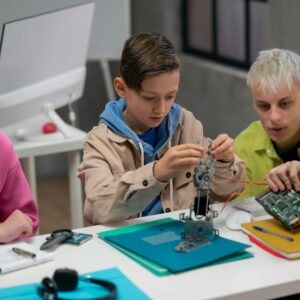 Children engaged in STEM robotics project.