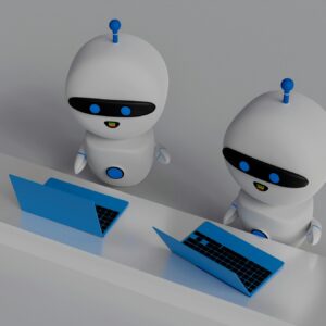 Two robots working on laptops