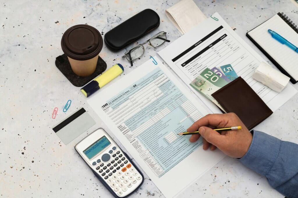 Accounts Receivable Banner.jpg Calculating finances with documents and coffee