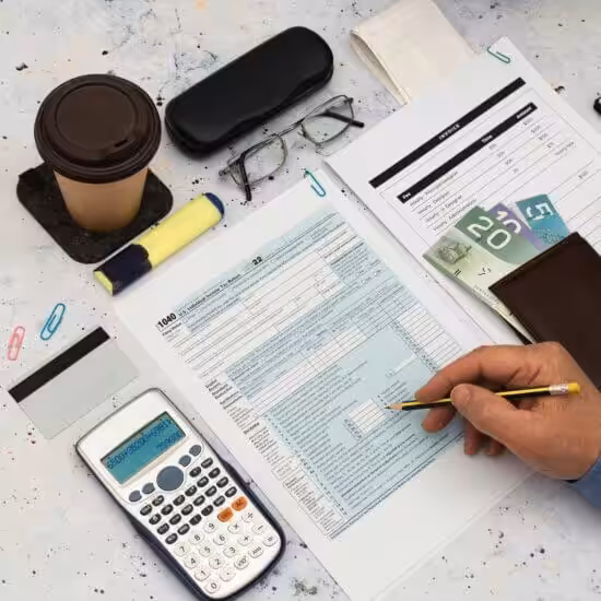 Accounts Receivable Banner.jpg Calculating finances with documents and coffee