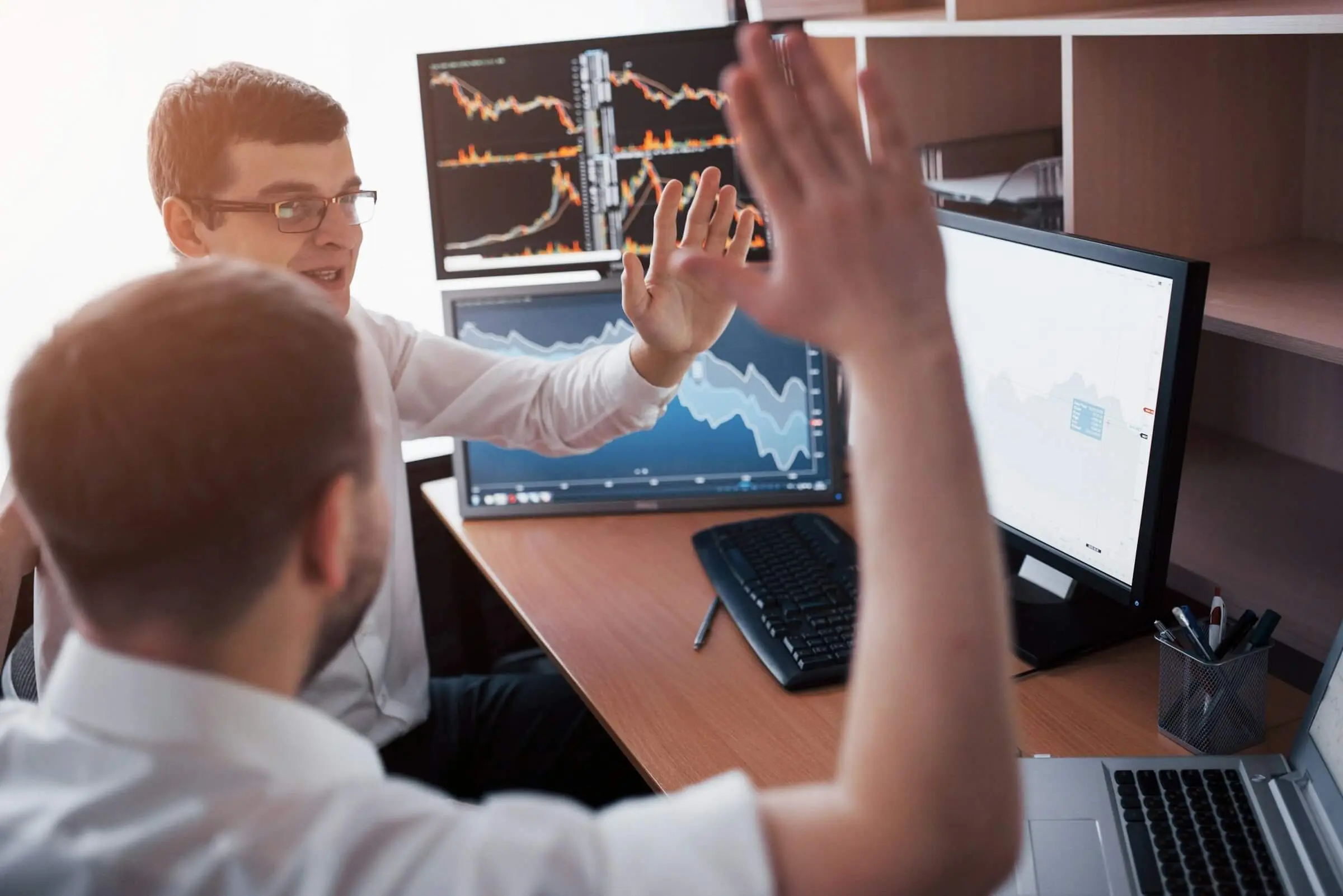 Two professionals discussing data analysis